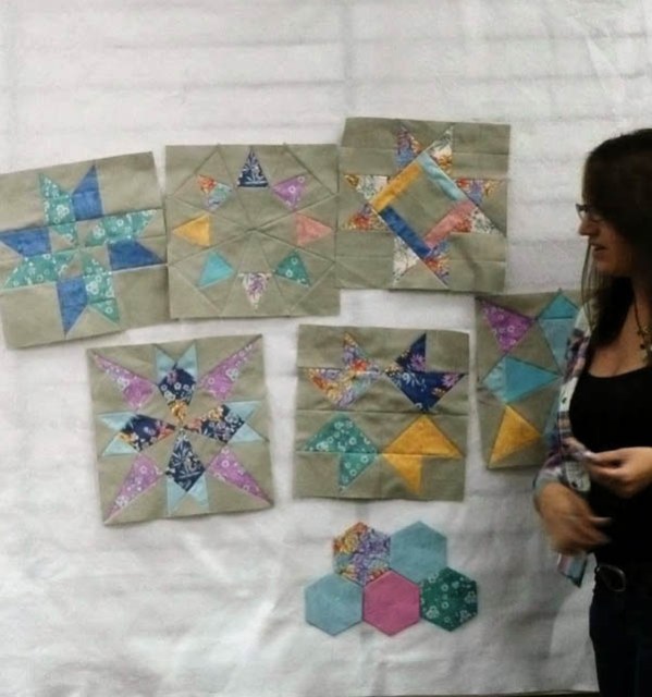 Putting my sampler blocks and some hexies on the design wall at the BMQ Guild Meetup in October