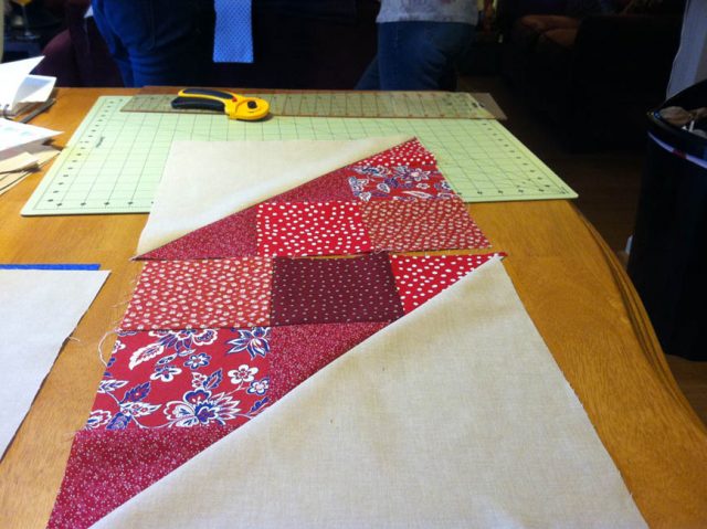 Putting thee pieces together. It took us a while to realize that the squares would not match up in the middle seam.