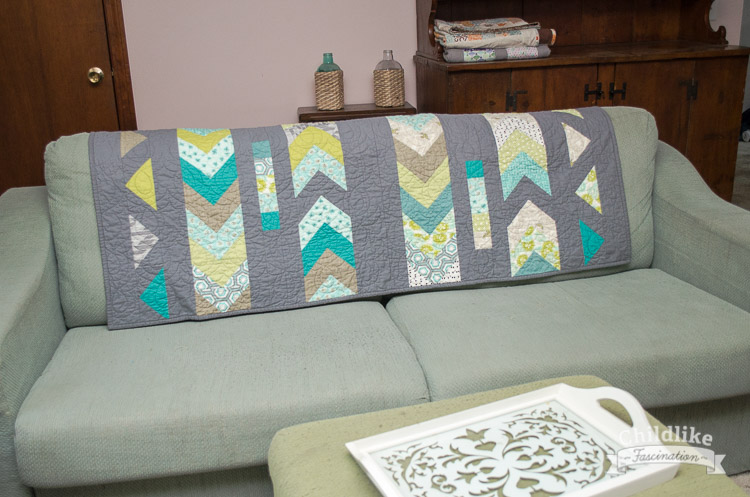 Goose Lane quilt over the back of my couch